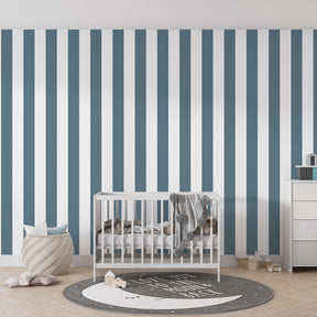 Vertical blue stripe wallpaper in modern children's bedroom with light wood furniture