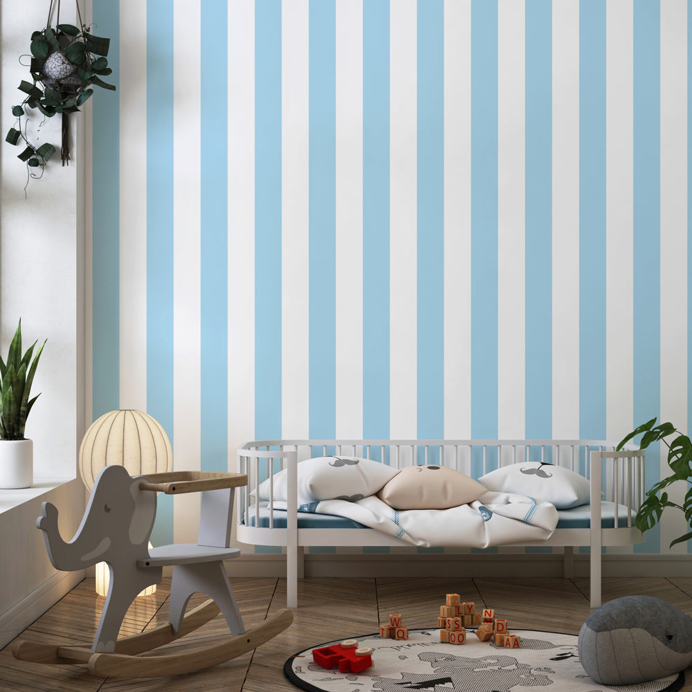 Soft blue striped mural wallpaper in kids playroom with natural light and toys by Kids-Mundo