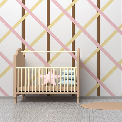 Kids-Mundo pink and cream diamond trellis wall mural behind a bed in a kids bedroom.
