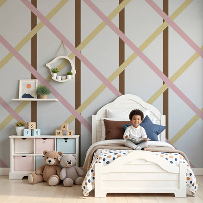 Kids-Mundo blush pink and cream trellis wall mural styled above a cot in a soft nursery.