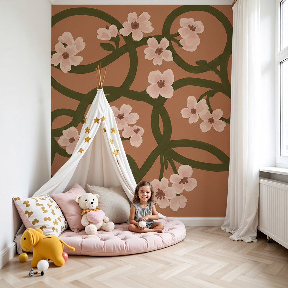 Kids-Mundo blush floral vine wall mural styled behind a cot in a nursery