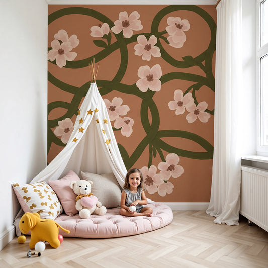 Kids-Mundo blush floral vine wall mural styled behind a cot in a nursery