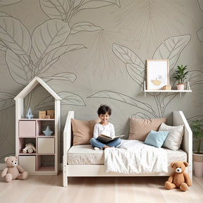 Delicate leaf botanical mural wallpaper in serene nursery with natural wood furniture by Kids-Mundo
