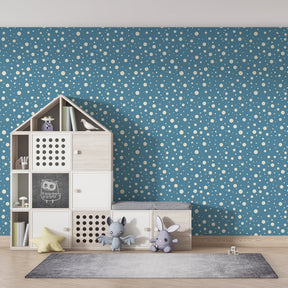 Calming bubble wallpaper creating serene atmosphere in children's bedroom with light furniture