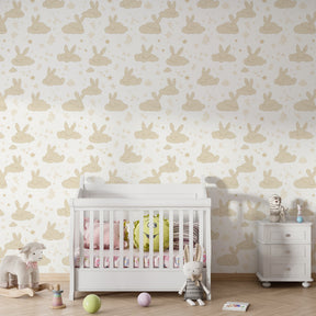 Dreamy rabbit wallpaper in neutral children's bedroom with soft cloud motifs and stars