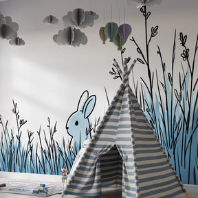 Gentle rabbit wallpaper in soft blue grass design for peaceful children's bedroom by Kids-Mundo