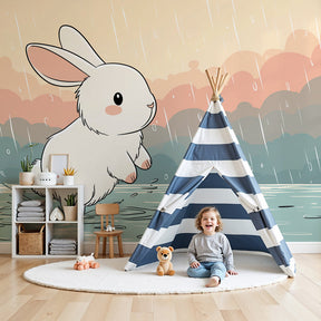 Bunny rain mural wallpaper decorating modern nursery with soft blue and pink tones by Kids-Mundo