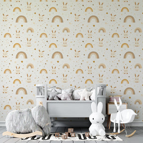 Golden rainbow and bunny wallpaper transforming children's bedroom into whimsical space