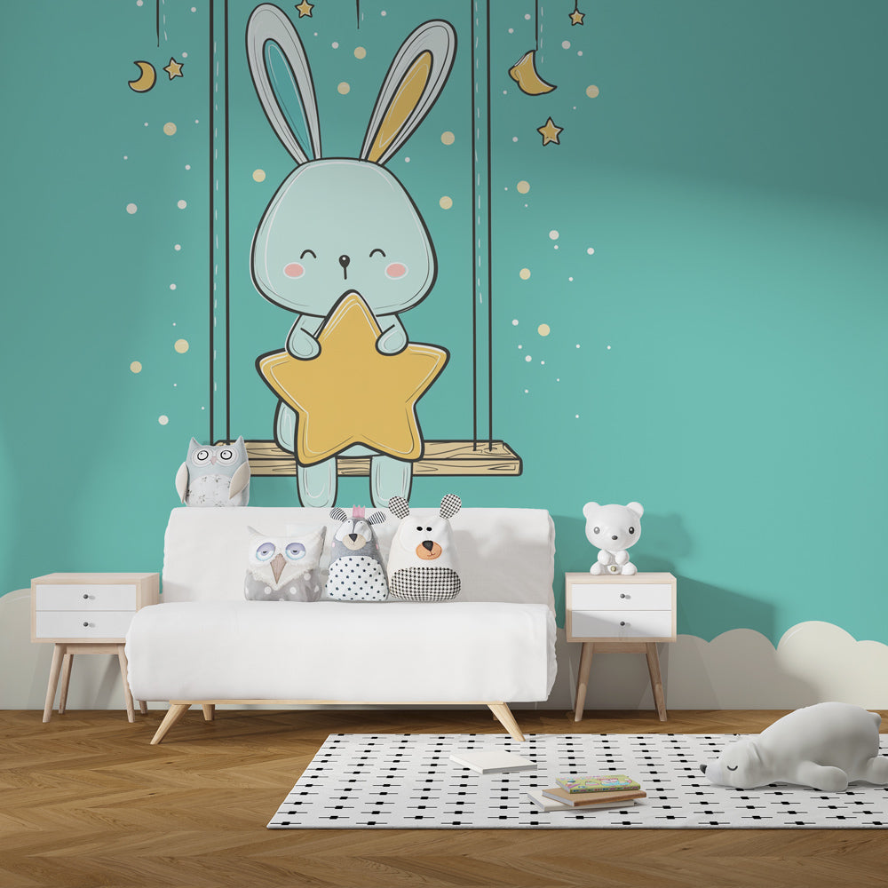 Starry night bunny wallpaper in modern baby room with light wood furniture and pastel decor