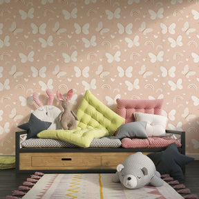 Pink butterfly rainbow wallpaper creating magical atmosphere in children's bedroom decor