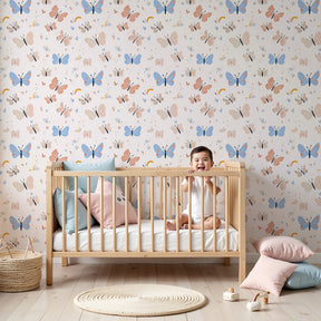 Pastel butterfly mural wallpaper creating magical nursery decor with soft pink and blue tones by Kids-Mundo