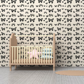 Delicate butterfly and rainbow wallpaper creating magical kids bedroom atmosphere
