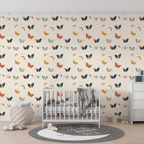 Colorful butterfly wallpaper creating magical kids bedroom atmosphere with rainbow motifs