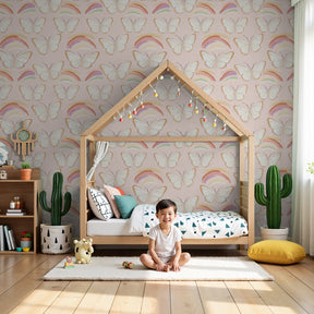 Delicate butterfly rainbow mural wallpaper in soft pink nursery by Kids-Mundo