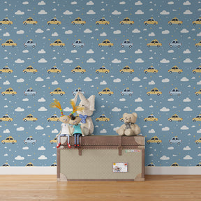Cars wallpaper creating playful atmosphere in children's bedroom with blue sky and vehicle motifs