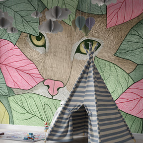 Animal themed mural wallpaper featuring cat among green pink yellow leaves in toddler room