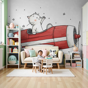 Cat pilot red airplane mural wallpaper decorating modern nursery with crib by Kids-Mundo