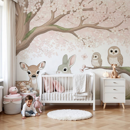 Kids-Mundo cherry blossom woodland wall mural with fawn, bunny and owls in a soft pastel nursery.