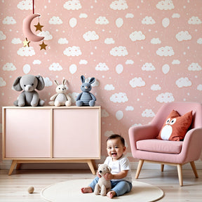 Pink cloud balloon mural wallpaper in modern nursery with white crib by Kids-Mundo