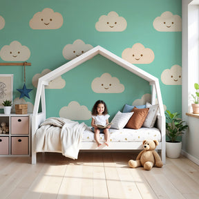 Smiling cloud mural wallpaper creating peaceful nursery atmosphere with aqua blue background by Kids-Mundo