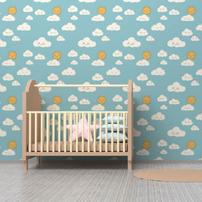 Blue sky mural wallpaper with fluffy clouds and happy suns in bright kids playroom setting