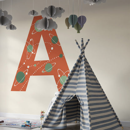 Kids-Mundo cosmic letter wall mural bringing colour to a bright playroom
