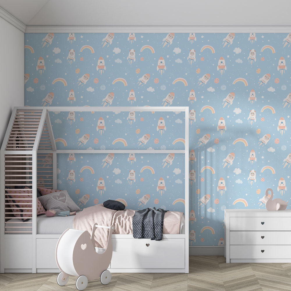 Kids-Mundo astronauts and rainbows wall mural covering a feature wall in a toddler bedroom