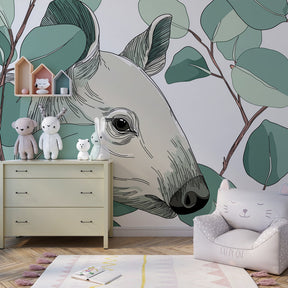 Woodland deer wallpaper creating serene kids bedroom with soft green nature theme