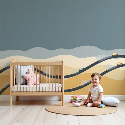 Kids-Mundo desert road wall mural with colourful cars, made to measure and shown in a soft neutral nursery.