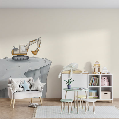 Kids-Mundo cliff edge digger wall mural in a calm playroom with a floor cushion and shelf.