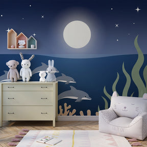 Marine life wallpaper featuring dolphins and coral creating underwater adventure in kids playroom