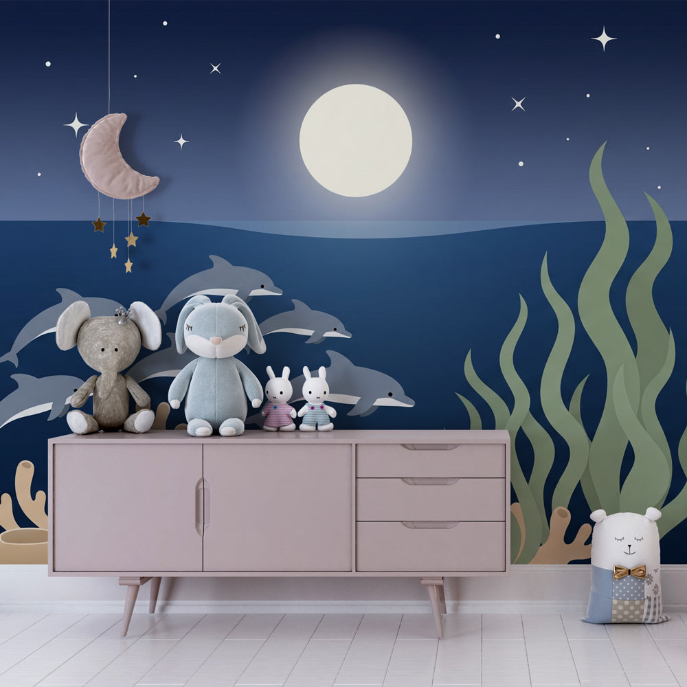 Ocean themed wallpaper with dolphins and moonlight in cozy children's room decor