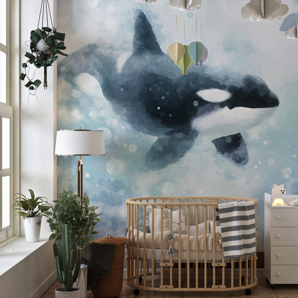 Kids-Mundo watercolour orca wall mural bringing a dreamy blue ocean scene to a kids bedroom.