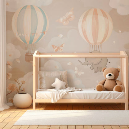 Kids-Mundo dreamy elephant balloon mural brightening a playroom wall with soft clouds and butterflies.