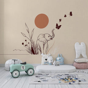 Gentle elephant and butterfly mural wallpaper for toddler room with natural wood furniture