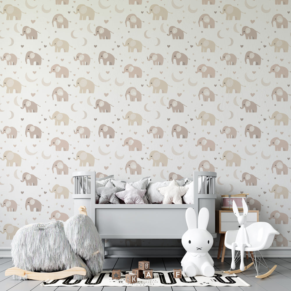 Gentle elephant mural wallpaper creating cozy reading corner in baby nursery