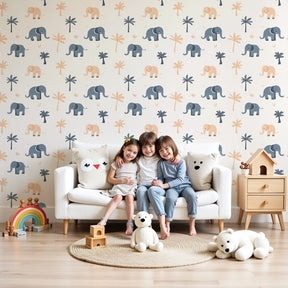 Elephant safari mural wallpaper in soft blue nursery with natural wood crib by Kids-Mundo