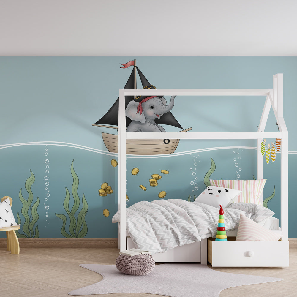 Ocean adventure mural wallpaper featuring elephant pirate in cozy baby bedroom setting