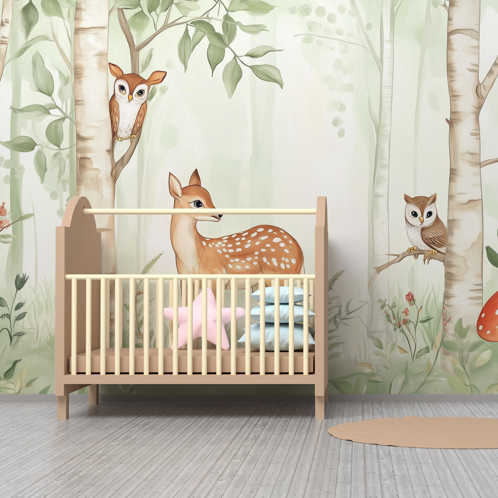Forest themed mural wallpaper with deer and owls transforming kids playroom into woodland sanctuary
