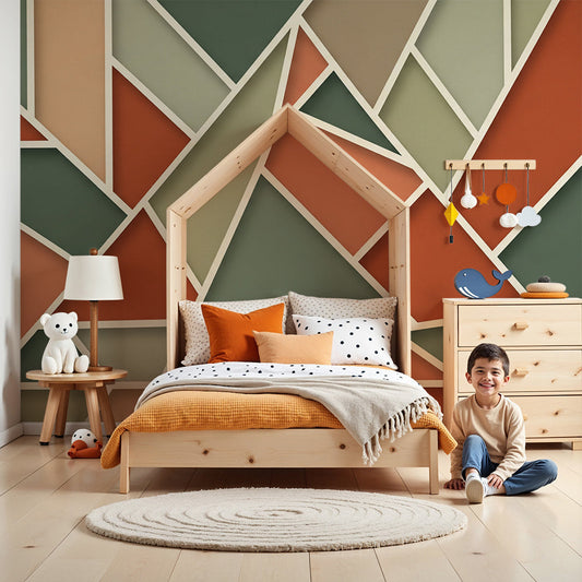Nursery with a faceted terracotta and sage triangle wall mural from Kids-Mundo behind a white cot