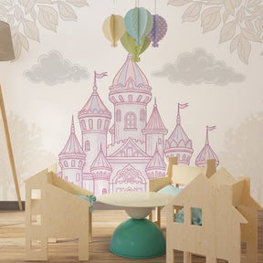 Pastel castle wallpaper creating magical nursery atmosphere with soft pink and cloud details