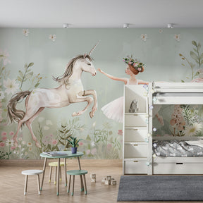 Soft green fairy tale mural wallpaper featuring unicorn and ballerina in playroom setting