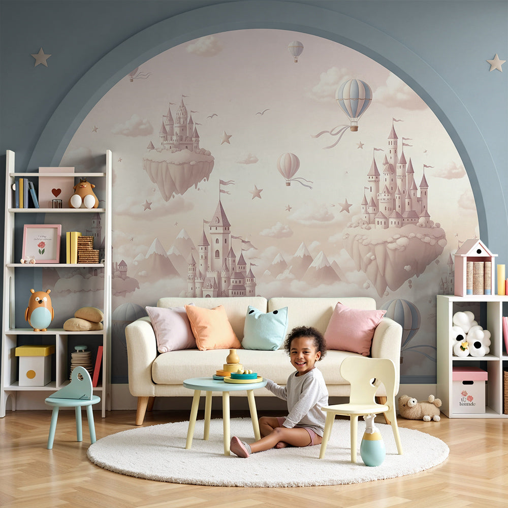 Kids-Mundo floating castle and hot air balloon wall mural styled in a soft pastel nursery room