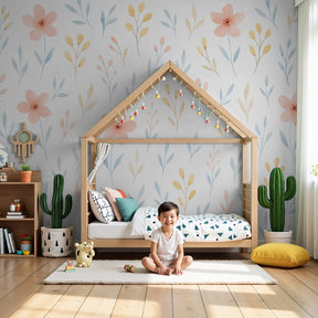 Delicate floral mural wallpaper with pink blooms in serene kids nursery by Kids-Mundo