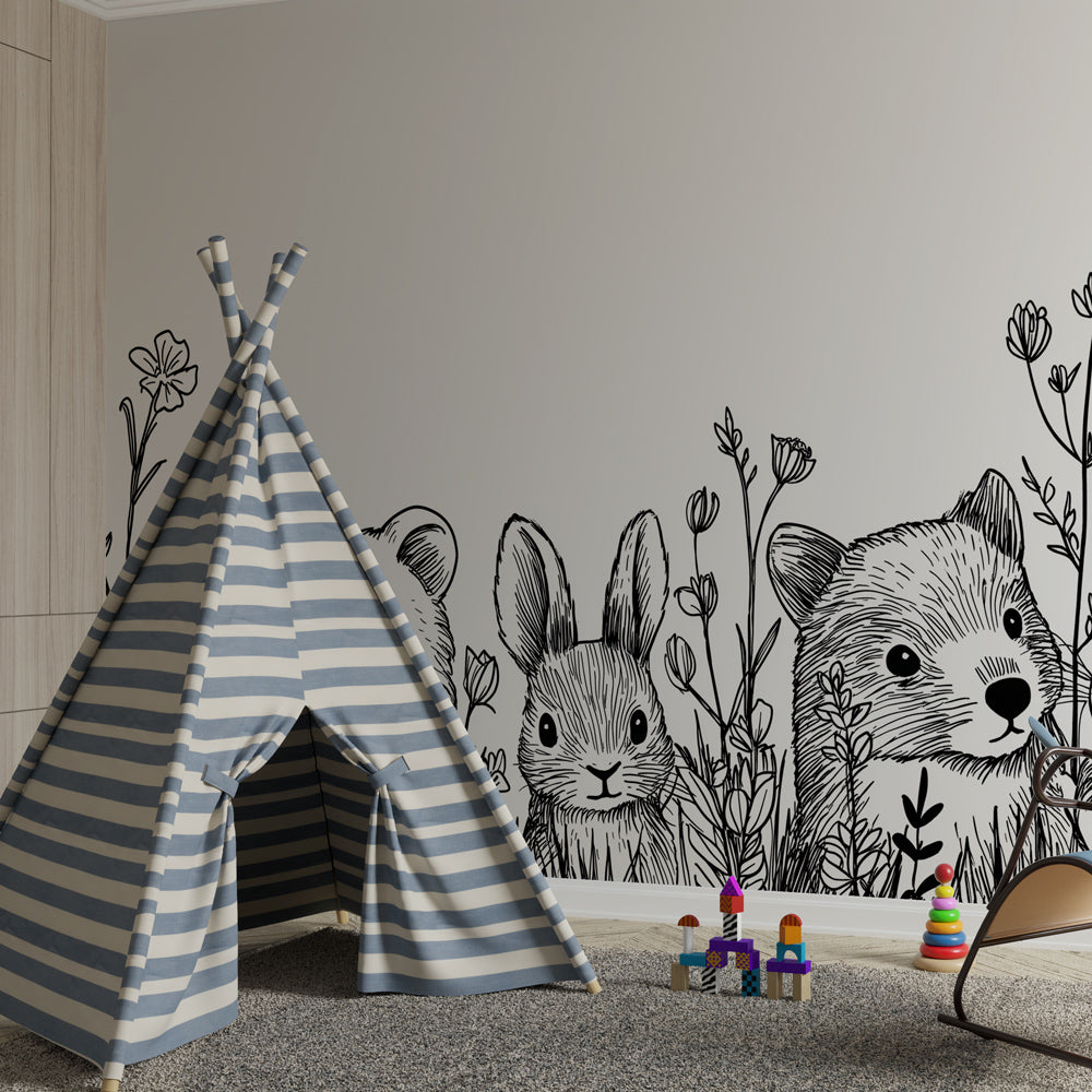 Black and white woodland animals wallpaper creating cozy children's bedroom with natural wood furniture