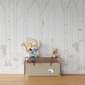 Forest themed mural wallpaper with playful squirrels for kids playroom design