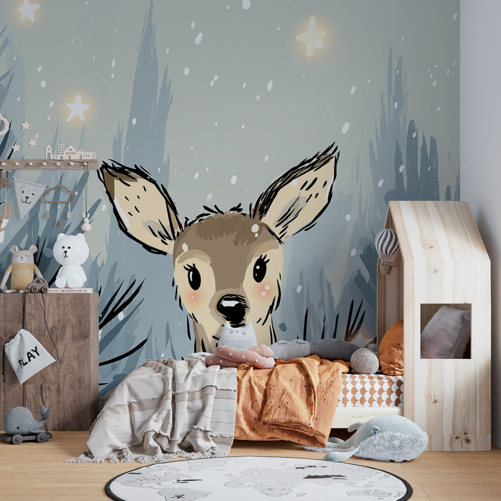 Soft blue forest deer wallpaper creating magical winter atmosphere in children's bedroom decor