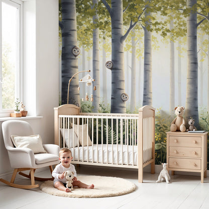 Kids-Mundo enchanted forest owl and birch tree wall mural styled behind a cot in a calm woodland nursery