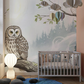 Peaceful owl mural wallpaper creating cozy reading corner in children's room