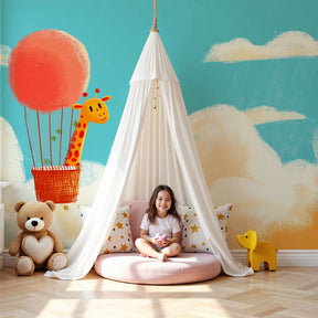 Giraffe hot air balloon mural wallpaper in modern nursery with soft lighting by Kids-Mundo